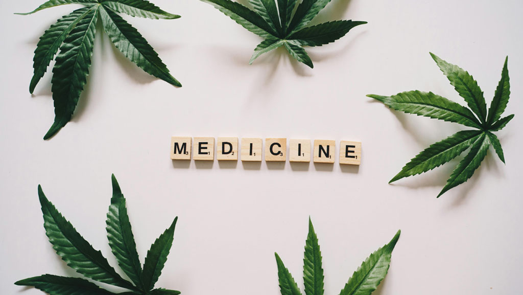 Exploring medical cannabis for autism: Cannabis leaves framing the word 'medicine,' representing the use of medical cannabis in autism treatment.