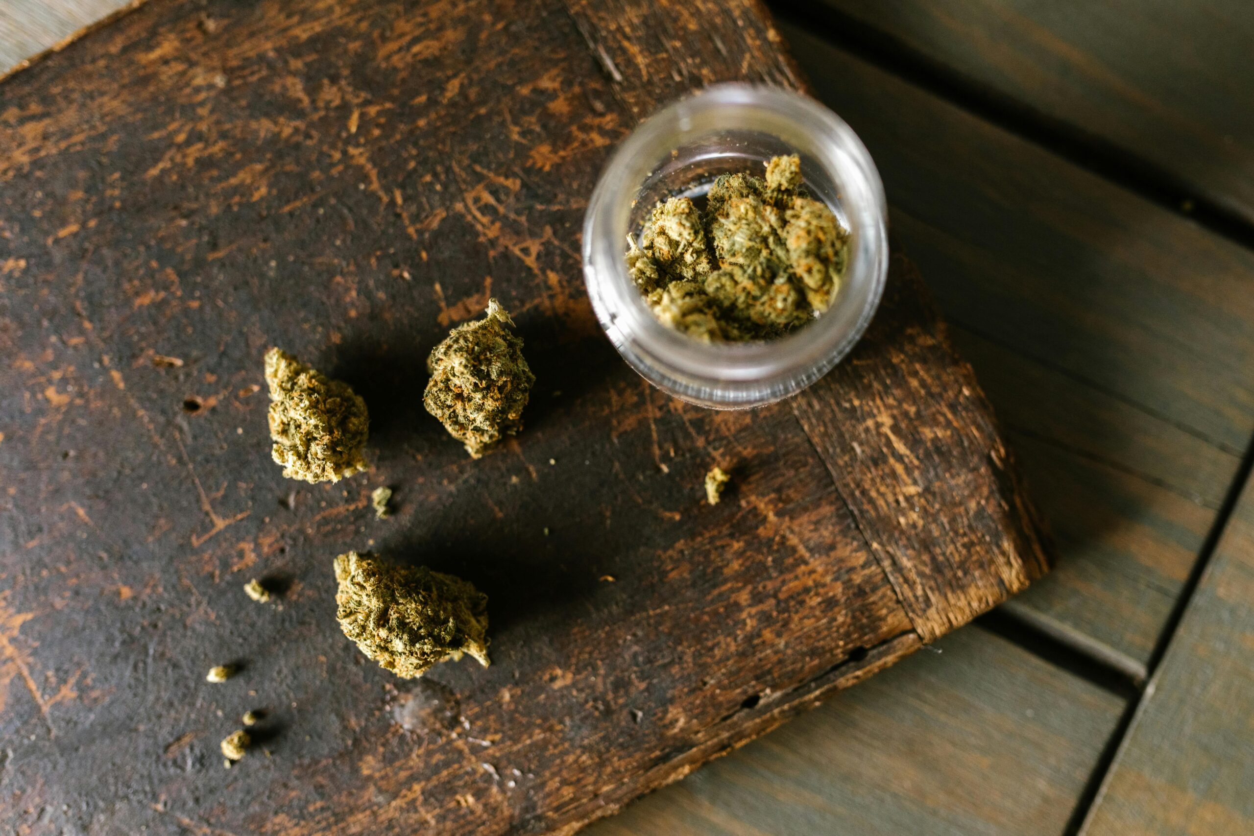 Man doing laundry to remove lingering cannabis smell from clothes after medical use.