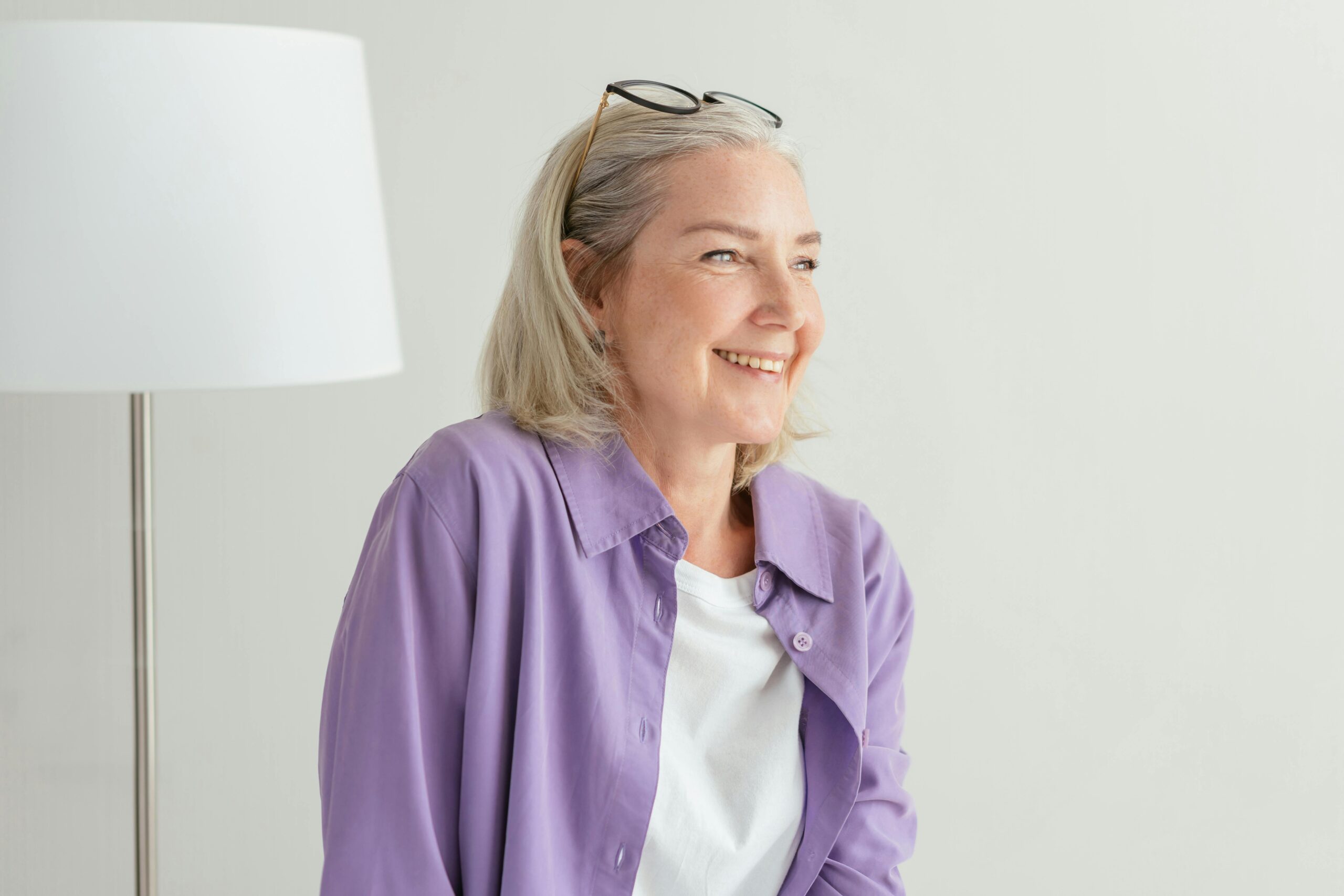 What are the benefits of sativa? Image of a woman feeling happy and focused.
