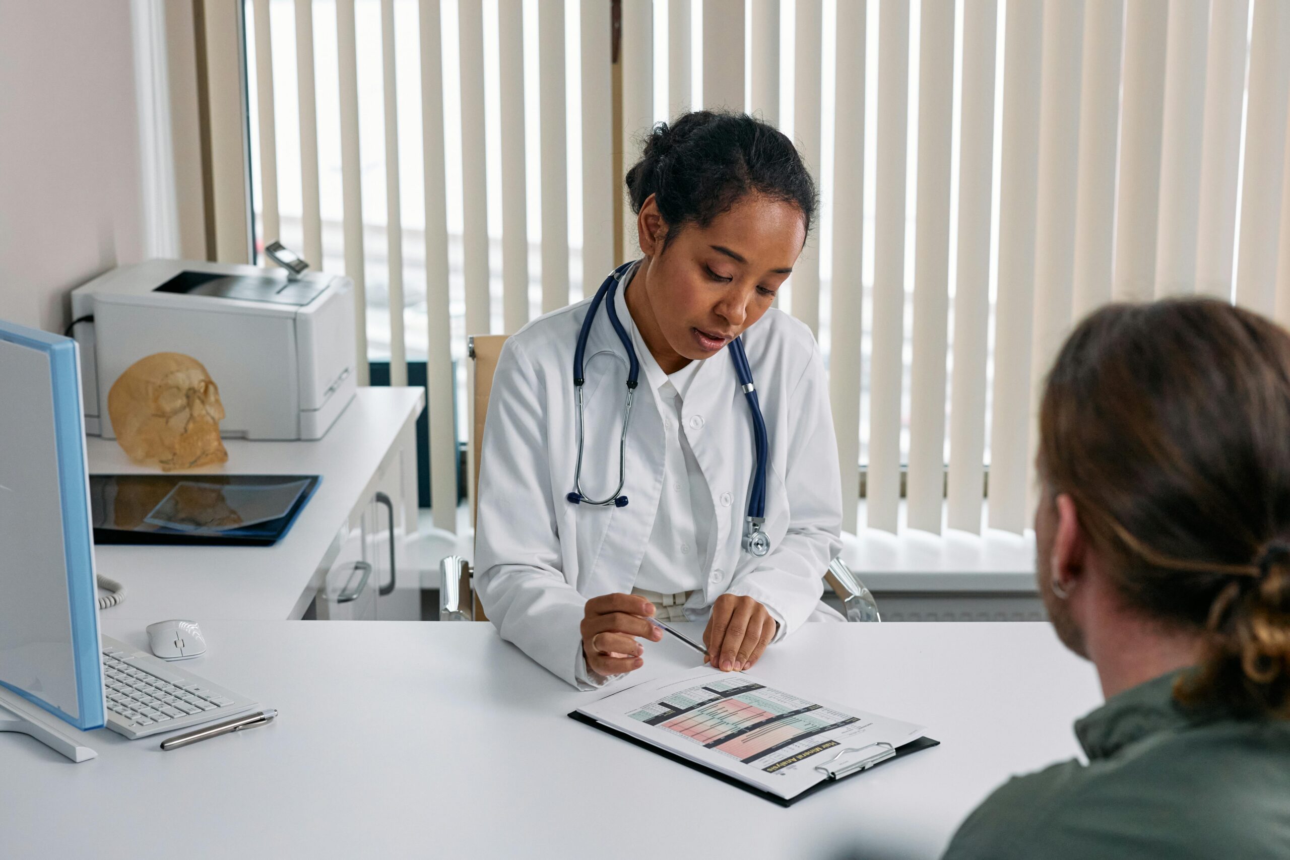 Doctor prescribing regulated medical cannabis to patient, highlighting safe and legal medical cannabis treatment in the UK.