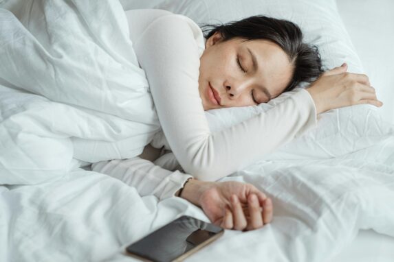 Woman sleeping peacefully supported by medical cannabis for restful nights