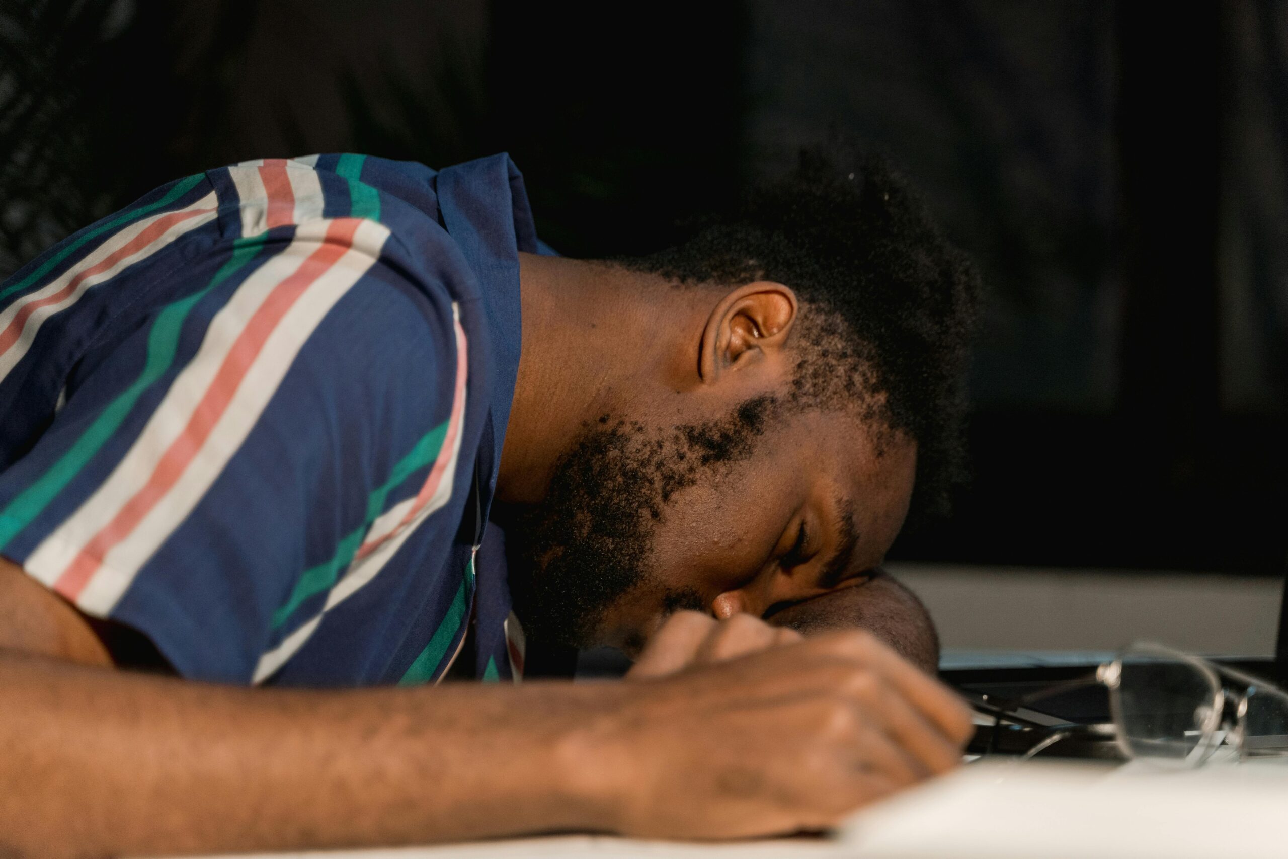 Man feeling drowsy from HHC effects, illustrating what is HHC and its impact on the body.