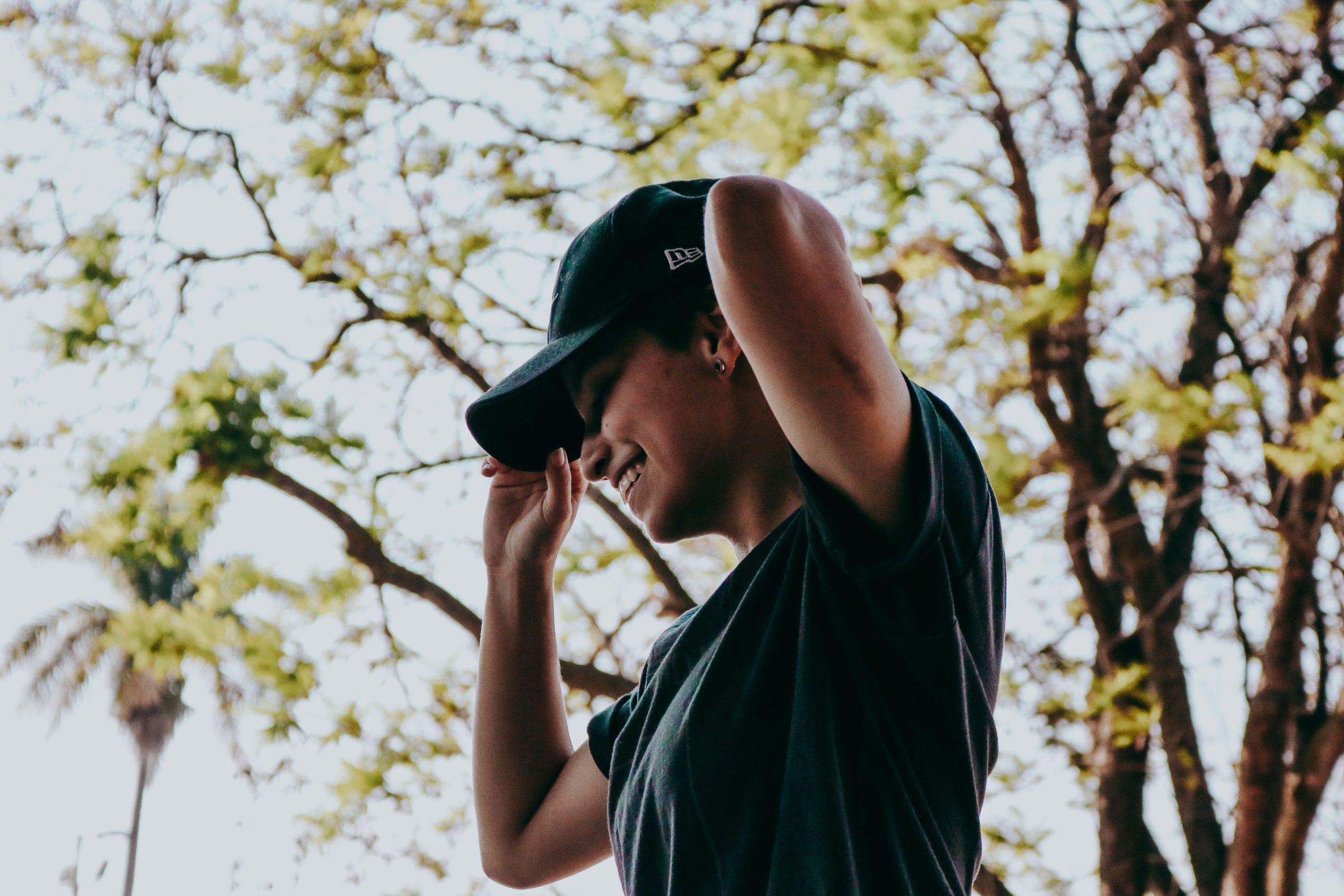 Person smiling outdoors exploring natural ways to support dopamine and serotonin