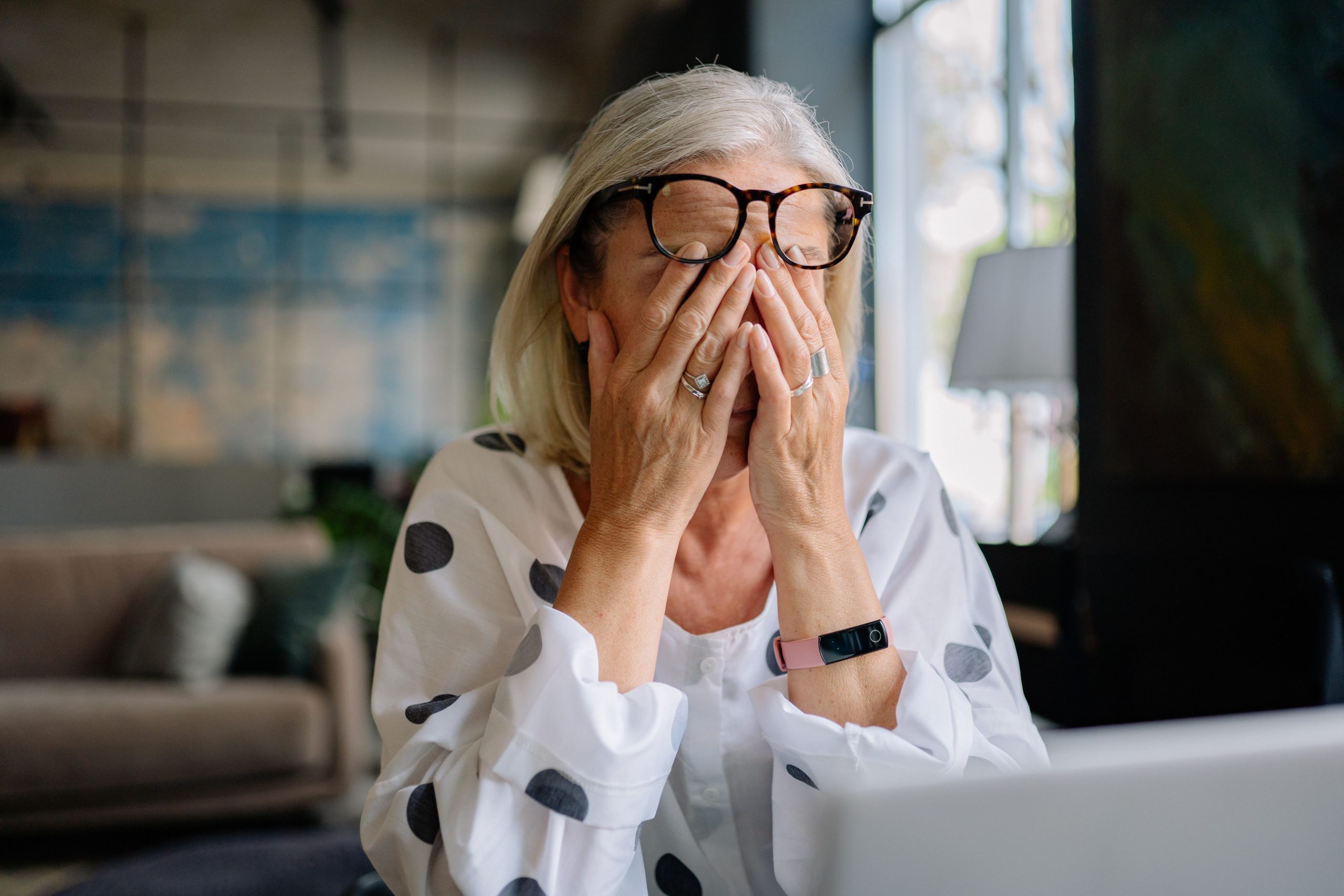 Stressed woman experiencing everyday stress while learning how to lower cortisol naturally