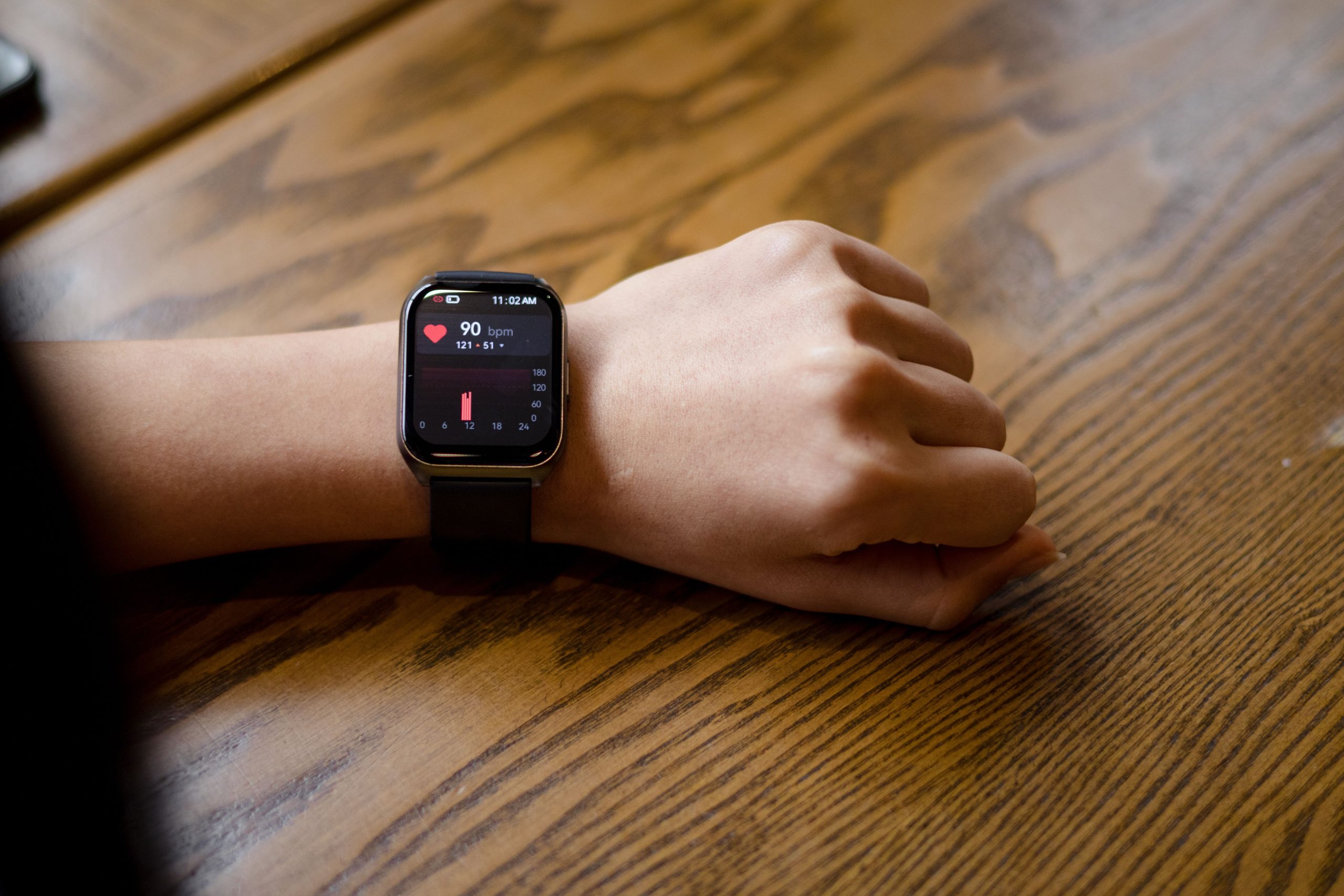 Woman checking her smartwatch while learning how to increase HRV