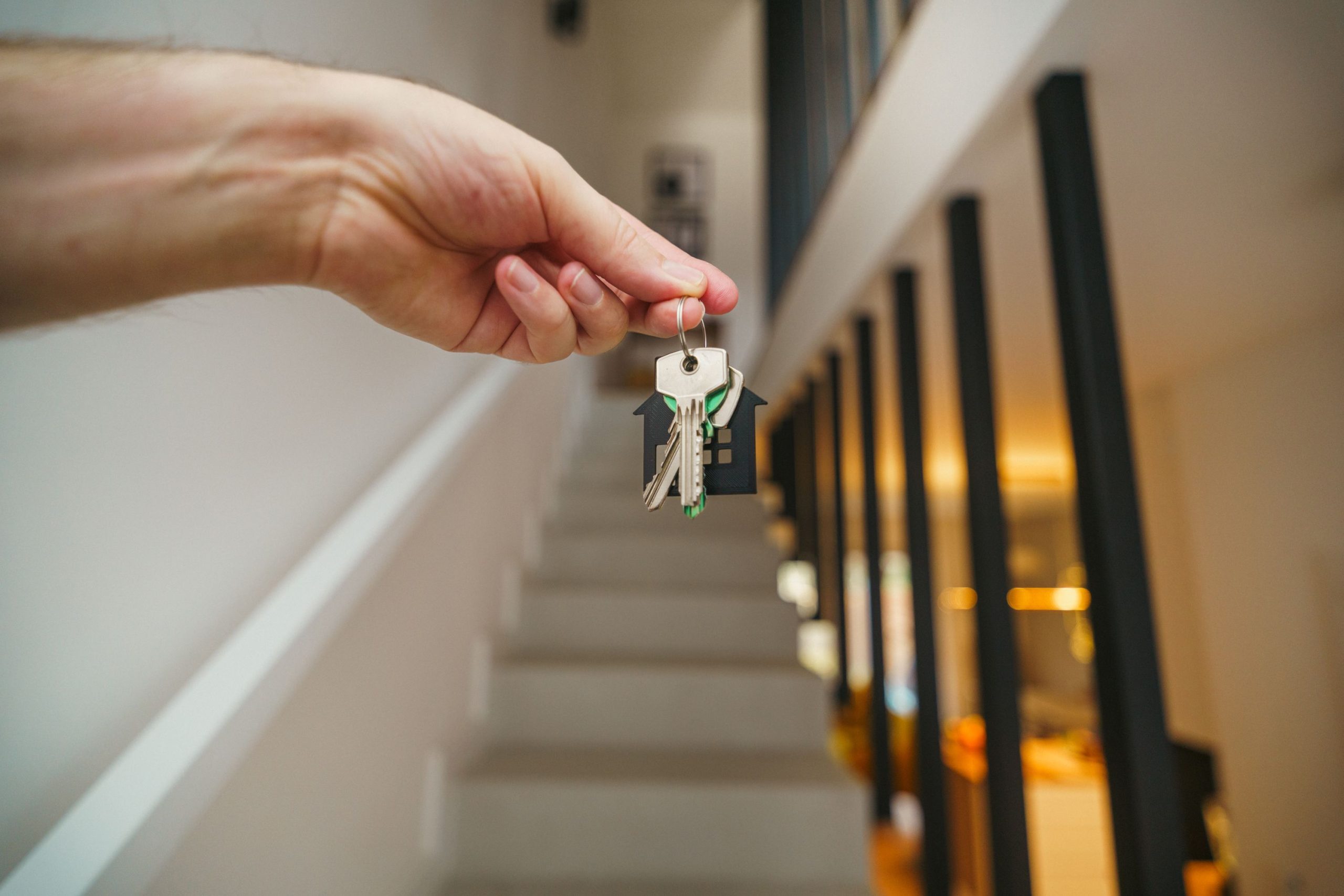 Person holding house keys inside a home, illustrating medical cannabis rights in rented properties in the UK